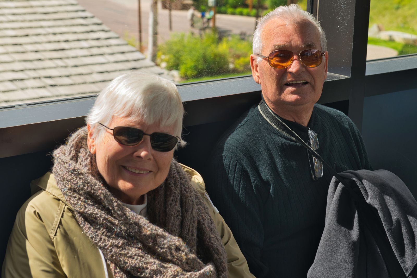 Older couple seated by a window